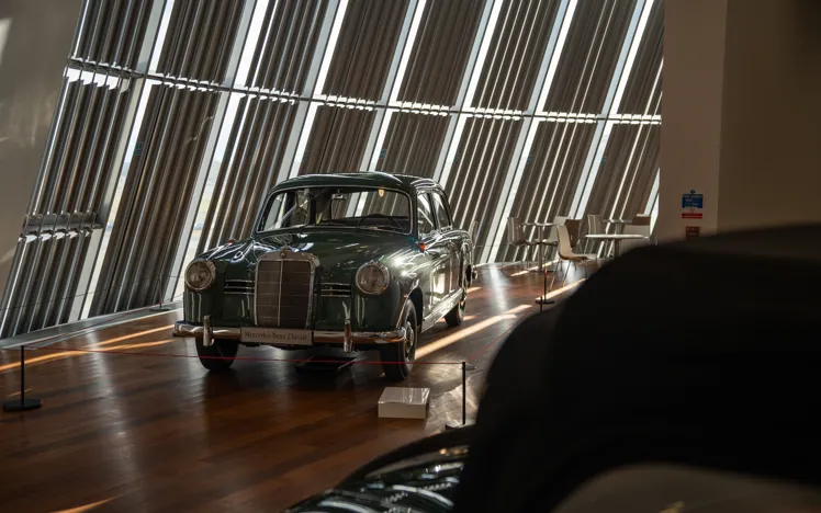 Guests enjoying a relaxed dining experience at The Bistro in Mercedes-Benz World, with natural light and a welcoming atmosphere.